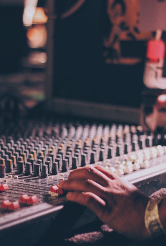 close-up-of-hand-using-sound-mixer-758611663-5b59ed004cedfd004b38458e